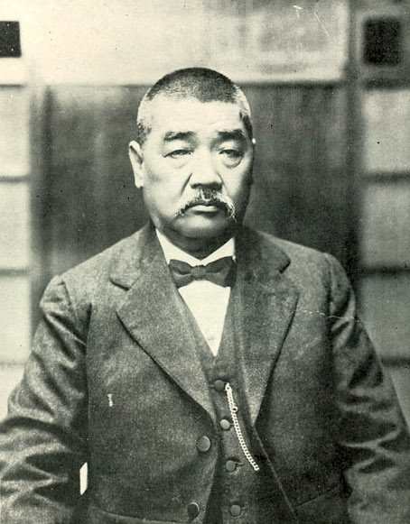 A person with a mustache Description automatically generated with medium confidence